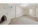 Spacious finished basement featuring neutral carpet and a unique corner fireplace at 9054 Dover St, Westminster, CO 80021