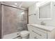 Bathroom featuring a glass-enclosed shower, tile, and a modern vanity at 9054 Dover St, Westminster, CO 80021