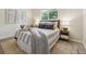 Comfortable bedroom with stylish bedding, side tables, and decor, creating a cozy and inviting space at 9054 Dover St, Westminster, CO 80021