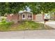 Charming single-Gathering home featuring a brick exterior, a well-manicured lawn, and mature trees for added curb appeal at 9054 Dover St, Westminster, CO 80021