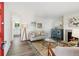 Cozy living room featuring a fireplace, modern furnishings, and an open layout that connects to the kitchen at 9054 Dover St, Westminster, CO 80021