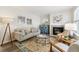 The living room features a fireplace, lots of natural light, and a decorative rug at 9054 Dover St, Westminster, CO 80021
