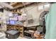 Unfinished basement area with storage bins and visible ceiling pipes provides ample storage space at 5704 Ammons St, Arvada, CO 80002