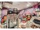 Finished basement featuring workout equipment, storage, and colorful décor at 5704 Ammons St, Arvada, CO 80002