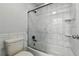 Bathroom featuring a tiled shower and white toilet at 19616 E Milan Cir, Aurora, CO 80013