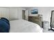 Comfortable bedroom with white bedding, modern dresser, and mountain art at 19616 E Milan Cir, Aurora, CO 80013