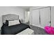 Bedroom with a carpeted floor, closet with curtains, and decorative pillows at 19616 E Milan Cir, Aurora, CO 80013