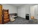 Bedroom features a closet, side table, and carpeted flooring at 19616 E Milan Cir, Aurora, CO 80013