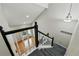 Staircase with white railings and new carpet leading to living room at 19616 E Milan Cir, Aurora, CO 80013
