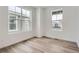 Bright bedroom with hardwood floors and large windows at 250 Paloma Way, Elizabeth, CO 80107