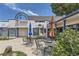 Outdoor patio area with tables and chairs and umbrellas at 250 Paloma Way, Elizabeth, CO 80107