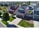 Aerial view of a neighborhood featuring well-maintained homes, green lawns, and tree-lined streets at 20768 Randolph Pl, Denver, CO 80249