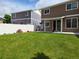 Green backyard with patio area and new fence at 20768 Randolph Pl, Denver, CO 80249