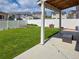 A covered patio is surrounded by a fenced and landscaped yard at 20768 Randolph Pl, Denver, CO 80249