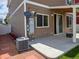 Back patio with outdoor seating and well maintained yard at 20768 Randolph Pl, Denver, CO 80249
