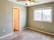 Bedroom featuring neutral paint and carpet, a ceiling fan, a window and a closet at 20768 Randolph Pl, Denver, CO 80249