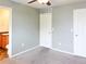 Bedroom with en-suite bathroom and neutral gray walls at 20768 Randolph Pl, Denver, CO 80249