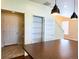 View of kitchen island, pantry, and hall closet in a home with hardwood floors at 20768 Randolph Pl, Denver, CO 80249