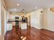 Open-concept kitchen with white cabinetry, stainless steel appliances, and a central island at 20768 Randolph Pl, Denver, CO 80249