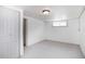 Neutral bedroom with carpeted floors, bright window, and closet at 4325 S Cherokee St, Englewood, CO 80110
