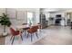 Bright dining area with a wooden table, seating for four, and modern art accents, adjacent to the kitchen at 4325 S Cherokee St, Englewood, CO 80110
