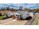 Charming exterior elevation with brick-lined porch and rock landscaping at 4325 S Cherokee St, Englewood, CO 80110