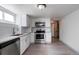 Clean and modern kitchen with stainless steel appliances and white cabinetry at 4325 S Cherokee St, Englewood, CO 80110