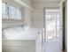 Bright laundry room with modern appliances and easy access to the backyard at 4325 S Cherokee St, Englewood, CO 80110