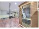 Basement gym and sauna featuring hardwood floors and ample lighting at 6451 Crestbrook Dr, Morrison, CO 80465