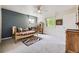 This bedroom features carpet floors, a ceiling fan, and blue accent wall at 6451 Crestbrook Dr, Morrison, CO 80465