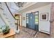 Inviting foyer with a two-story ceiling, chandelier, a wooden staircase, and tiled flooring at 6451 Crestbrook Dr, Morrison, CO 80465