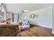 Comfortable living room featuring built-in shelving, hardwood flooring, and a large bay window at 6451 Crestbrook Dr, Morrison, CO 80465