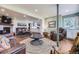 Open living space with hardwood floors, fireplace, and seamless connection to the adjacent kitchen at 6451 Crestbrook Dr, Morrison, CO 80465