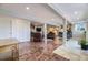 Open concept living room with fireplace and access to kitchen at 6451 Crestbrook Dr, Morrison, CO 80465
