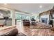 Open concept living room with a fireplace and access to the kitchen at 6451 Crestbrook Dr, Morrison, CO 80465