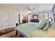 Bright primary bedroom with ensuite bathroom access, natural light, and ample space at 6451 Crestbrook Dr, Morrison, CO 80465