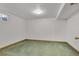 Unfinished basement with green carpet at 2002 Truda Dr, Northglenn, CO 80233