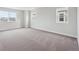 Spacious bedroom with neutral walls, plush carpeting, and two windows offering lots of natural light at 5549 Riverbend Ave, Firestone, CO 80504