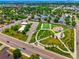 Aerial view of community with a nearby park, soccer field, and walking trail for outdoor activities at 8701 Huron St # 2-106, Thornton, CO 80260