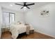 Well-lit bedroom with modern decor, a comfortable bed, and a large window at 8701 Huron St # 2-106, Thornton, CO 80260