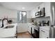 Bright and airy kitchen with sleek countertops and stainless steel appliances at 8701 Huron St # 2-106, Thornton, CO 80260