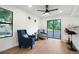 Bright living room features modern fan, light hardwood floors, comfortable seating, and natural light at 8701 Huron St # 2-106, Thornton, CO 80260