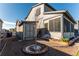 Cozy backyard featuring storage shed, a patio area, and lush landscaping around the back of the house at 2355 Saddle Back Ct, Fort Lupton, CO 80621