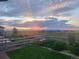 Inviting backyard with green lawn, garden, and scenic views, perfect for relaxing evenings at 2355 Saddle Back Ct, Fort Lupton, CO 80621