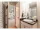 Bathroom with a white vanity, a dark countertop, and a mirror at 2355 Saddle Back Ct, Fort Lupton, CO 80621