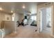 Bonus room with fitness equipment, a TV, and natural light at 2355 Saddle Back Ct, Fort Lupton, CO 80621