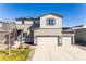 Charming two-story home with a three-car garage, well-maintained lawn, and solar panels at 2355 Saddle Back Ct, Fort Lupton, CO 80621