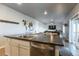 Open living area connects kitchen and dining with a comfortable seating area at 2355 Saddle Back Ct, Fort Lupton, CO 80621
