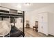 Bedroom with bunkbeds, wood-look flooring, two chairs and a large wardrobe at 1165 S Fairplay Cir # B, Aurora, CO 80012