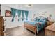 Relaxing bedroom with natural light, wood-frame bed, and matching nightstands at 1165 S Fairplay Cir # B, Aurora, CO 80012